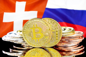 Concept for investors in cryptocurrency and Blockchain technology in the Switzerland and Russia. Bitcoins on the background of the flag Switzerland and Russia.