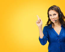 Call Center Servise. Customer Support Phone Sales Operator Pointing On Something Or Copy Space Area For Some Text, Over Yellow Orange Color Background