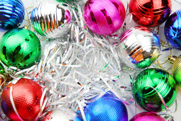 Colorful Christmas balls on white background. Holiday postcard. Top view.