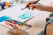 © golubovy - Contemporary art. Cropped shot of young female painter creating abstract artwork with watercolor.
