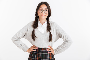 Wall Mural - Photo closeup of cheerful teenage girl wearing eyeglasses and school uniform smiling at camera