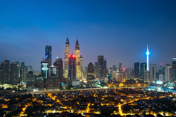 Wall Mural - Kuala lumpur cityscape. Panoramic view of Kuala Lumpur city skyline during sunrise viewing skyscrapers building and Petronas twin tower in Malaysia.