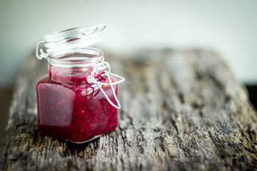 homemade berry jam from red berries selective focus, toning