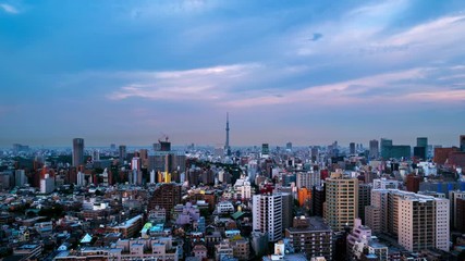 Sticker - Tokyo, Japan. Skyline in the evening. Cloudy sky over urban area in Bunkyo, Tokyo, Japan. Time-lapse in the evening