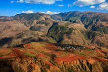 Dongchuan Red Earth Multi-Colored Terraces - Red Soil, Green Grass, Layered Terraces In Yunnan Province, China. Chinese Countryside, Agriculture, Exotic Unique Landscape. Farmland, Agriculture