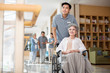 © Blue Jean Images - Young nurse assistant taking care of senior woman in wheelchair