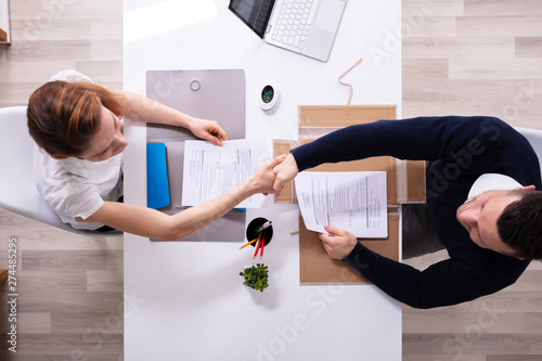 Cuadros en Lienzo Businessman Shaking Hand With Female Applicant