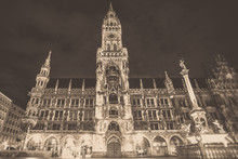 Munich Germany, New Town Hall , Rathaus At The Marienplatz Seen At Night With Vintage Black And White Filter