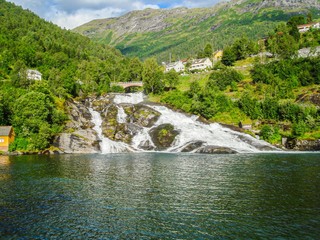 Wall Mural - Norwegian fjords. Mountain valley landscape. Mountain river waterfall landscape. Nature background.