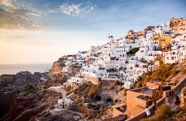 impressive evening view of Santorini island. Picturesque spring sunset on the famous Greek resort Oia, Greece, Europe. Traveling concept background.