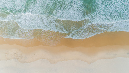  Underwater sea level photo of tropical exotic paradise bay with beautiful blue sky and clouds.