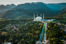Islamabad / Pakistan - April 25 2019: Aerial Photo Of Islamabad, The Capital City Of Pakistan Showing The Landmark Shah Faisal Mosque And The Lush Green Mountains Of The City
