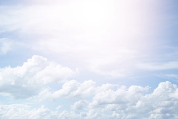 Beautiful clear blue sky background with  plain  large white cloud on morning time rays sunlight. space for text. soft focus.