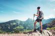 © XtravaganT - Fit female hiker standing on a mountain ridge