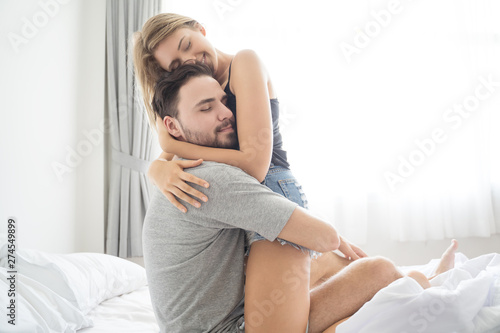 Young Couple Hugging In The Bed Loving Couple In Bedroom