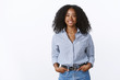 © Cookie Studio - Charismatic cheerful attractive african american woman curly haircut wearing shirt holding hands pockets confident outgoing smiling, talking pleasant conversation, feeling self-assured relaxed