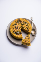 Wall Mural - Handvo/handwa is a vegetable cake originating from the Gujarat, India. selective focus