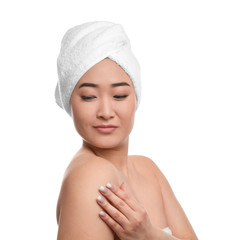 Poster - Portrait of beautiful Asian woman with towel on head against white background. Spa treatment