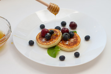 Wall Mural - pancakes with blueberries and honey