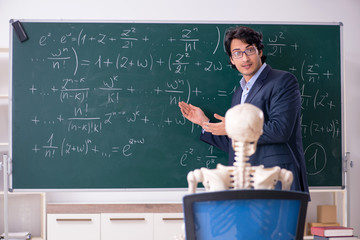 young male math teacher and student skeleton