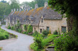 © dean - Row Of Old English Stone Cottages Set In The Cotswold Village Of Bibury
