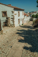 Poster - Facade of old houses in cobblestone alley