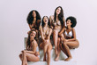 © oneinchpunch - Group of women with different body and ethnicity posing together to show the woman power and strength. Curvy and skinny kind of female body concept