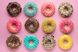 Fototapeta  - Colorful sweet background. Delicious glazed donuts on pink background. 