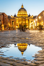Vatican City By Night. Illuminated Dome Of St Peters Basilica And St Peters Square. Group Of Tourists On Via Della Conciliazione. Rome, Italy