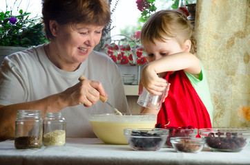 Portrait of faces, hands happy brown-haired granny, granddaughter. toddler girl play with baking, dough, flour on kitchen. child baby try study cooking cookies, cake. Cozy family Look at each other