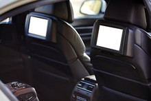 Car Inside Headrest Screens Mock Up. Interior Of Prestige Luxury Modern Car. Two White Tv Displays For Back Seats Passengers