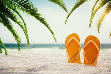 Orange Flip Flops On Beach