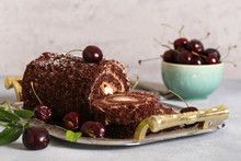 Chocolate Dessert Roll With Vanilla Cream And Sweet Cherry