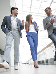 Wall Mural - Business people walking in the office corridor