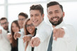 © ASDF - happy business team pointing at you.