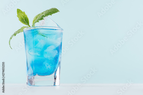 Blue Curacao Cocktail With Ice Cubes Green Mint In Luxury