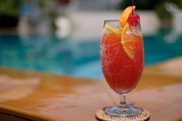 Wall Mural - fruit punch mocktail at swimming pool