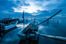 Boats Or Canoes In The Dock And The Blue Sunset In Campeche Mexico.