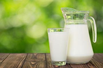 Sticker - milk in glass and jug on table