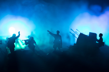 War Concept. Military silhouettes fighting scene on war fog sky background,