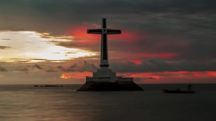 Wall Mural - Day to night timelapse of sunset over the Sunken Cemetery on Camiguin island, Philippines