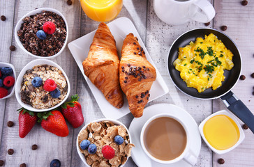 Breakfast served with coffee, juice, croissants and fruits