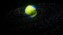 Tennis Ball With Water Drops In A Spiral On A Dark Background