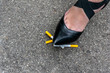 girl tramples cigarettes on asphalt, stop smoking, quit smoking, no smoking