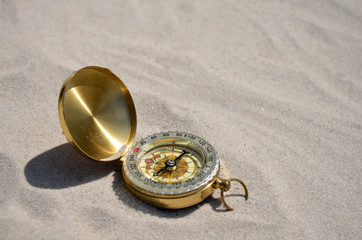 compass on the sand hot day 