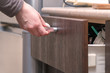 © pro2audio - Womans hand opens the drawer of table