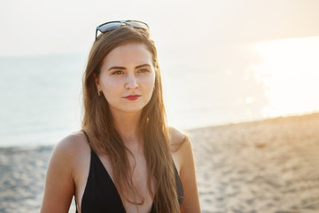 Canvas Print - Young cute girl on the beach.