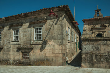 Wall Mural - Alleyway between gothic buildings and stone wall