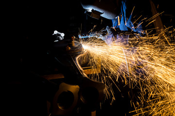 Workers are grooving with carbon welding wires With sparksWorkers are grooving with carbon welding wires With sparks