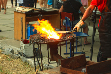 The blacksmith's anvil is made of forged or cast steel,wrought iron with a hard steel,street exhibition of forging metal